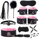 Premium pink‑lined wellness accessories set featuring soft faux‑fur cuffs, blindfold, and comfort tools for couples