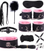 Premium pink‑lined wellness accessories set featuring soft faux‑fur cuffs, blindfold, and comfort tools for couples