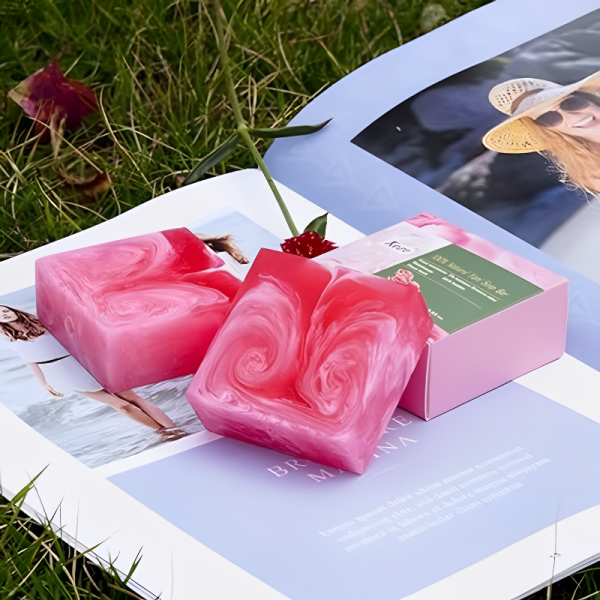 Natural Rose Care Soap bar featuring vibrant pink swirls, highlighting its nourishing ingredients of rose petals and essential oils.