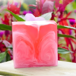 Natural Rose Care Soap bar featuring vibrant pink swirls, highlighting its nourishing ingredients of rose petals and essential oils.